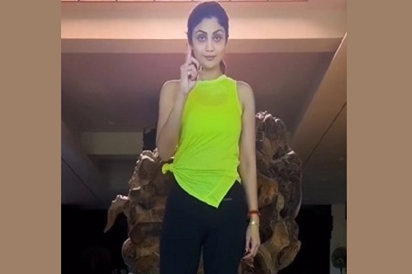 Shilpa Shetty demonstrates a yoga pose that helps improve balance and concentration