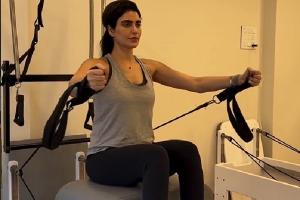Mommy-to-be Karishma Tanna flaunts her baby bump as she works out in the gym