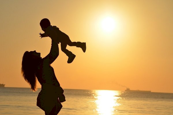 The Unbreakable Bond: A Mother's Love at Sunset