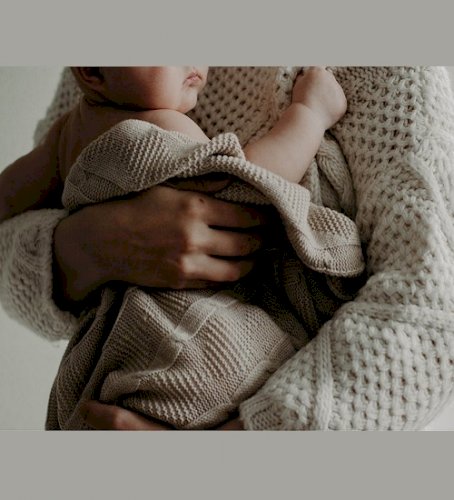 Wrapped in Warmth: The Heart of Motherhood and Parenting